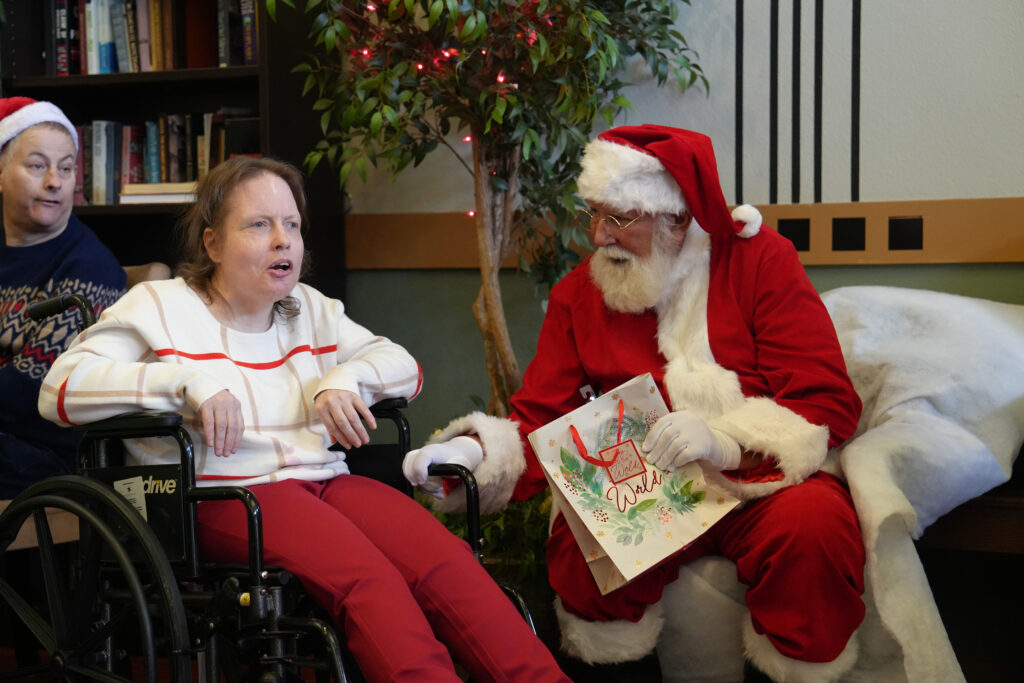 Deanna sitting with Santa Claus