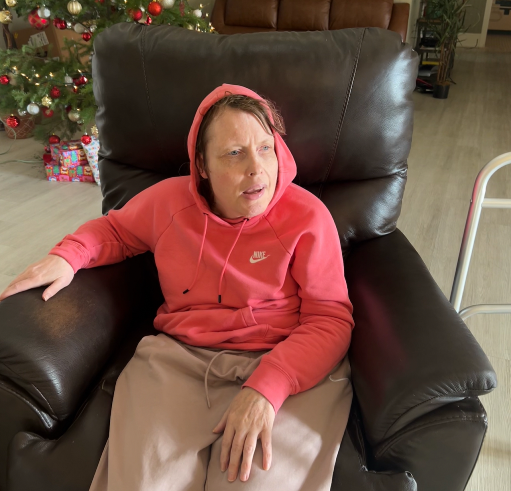 Deanna sitting is a big comfy chair.